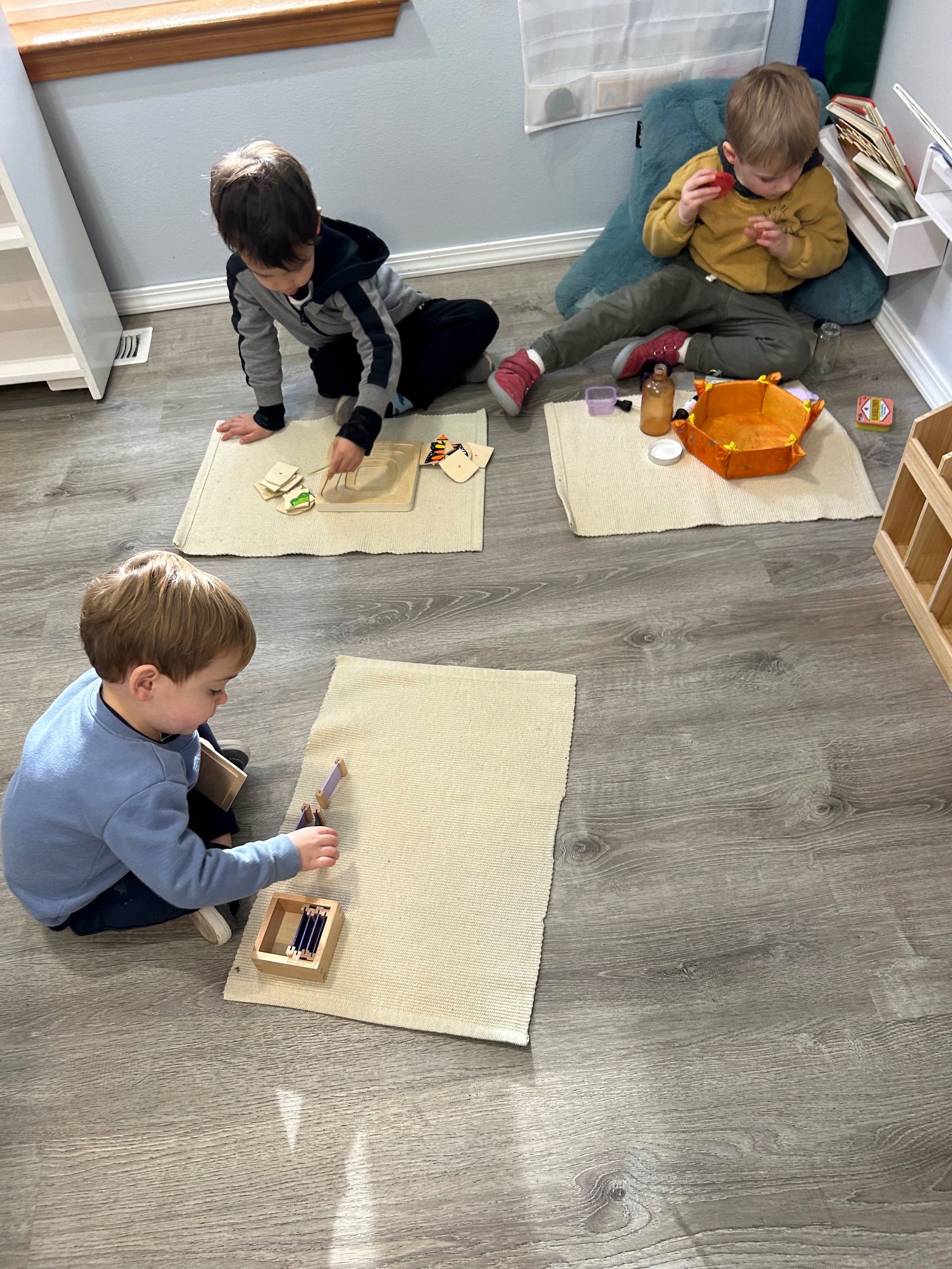 Children working together in a Montessori classroom