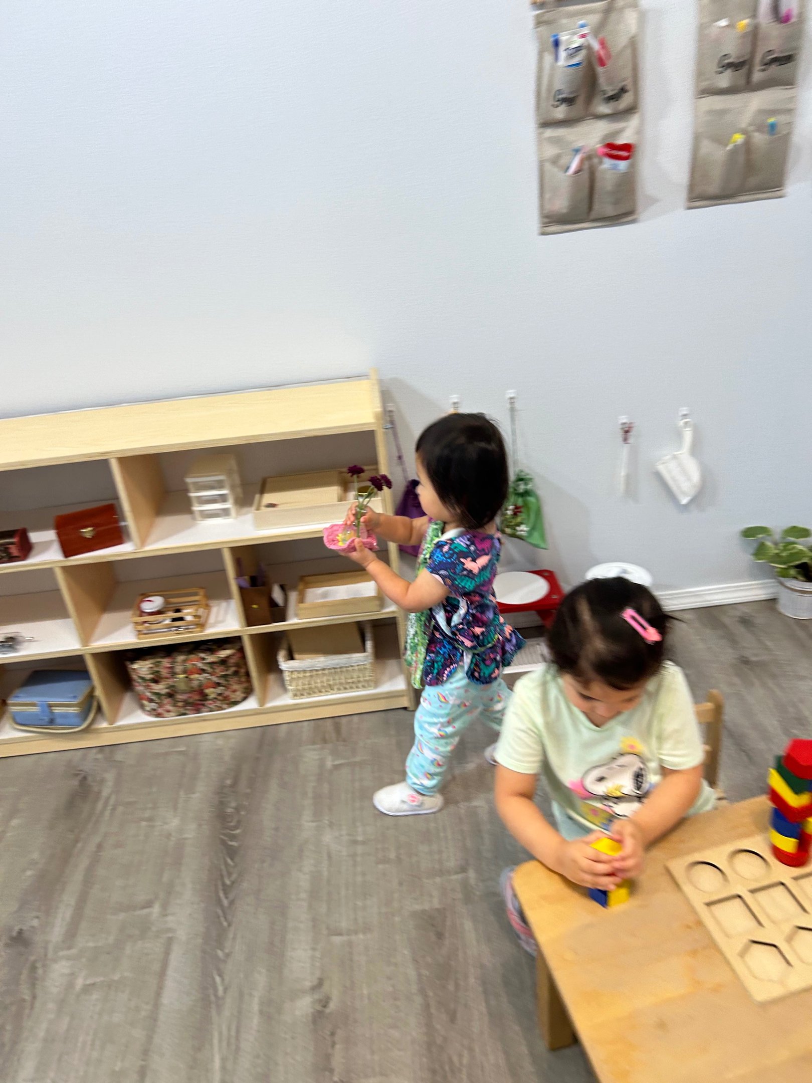 Children working with flowers and classroom materials