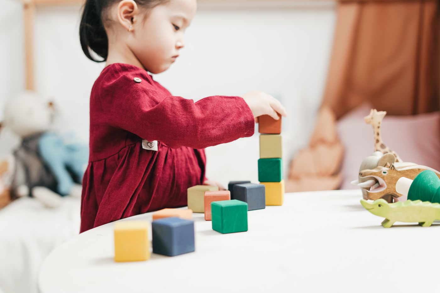 Child working with learning blocks