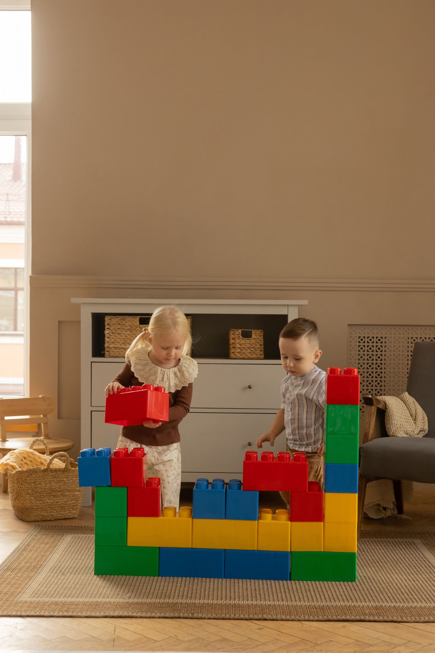 Children building with large blocks